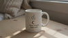 video of Self care ritual mug filled with coffee being lifted from a table